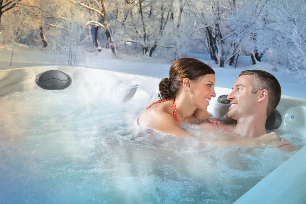 couple in hot tub in the winter